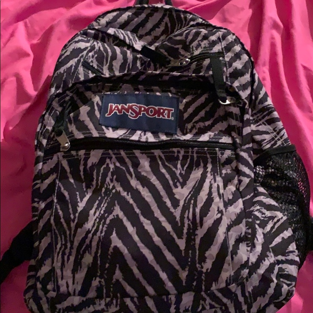 This is a gray zebra print jansport backpack
